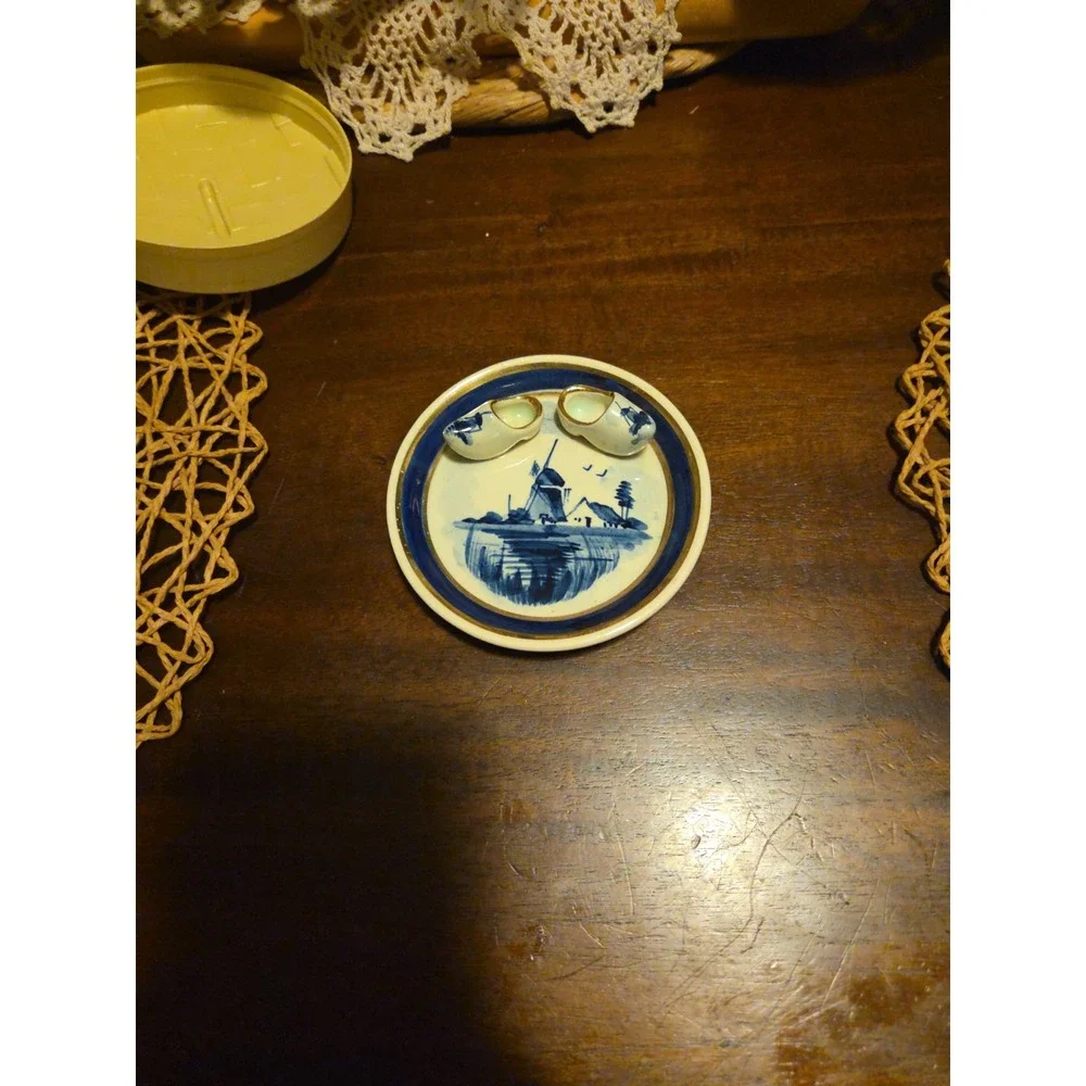 delft blue hand painted holland plate With Little Shoes Attached.
